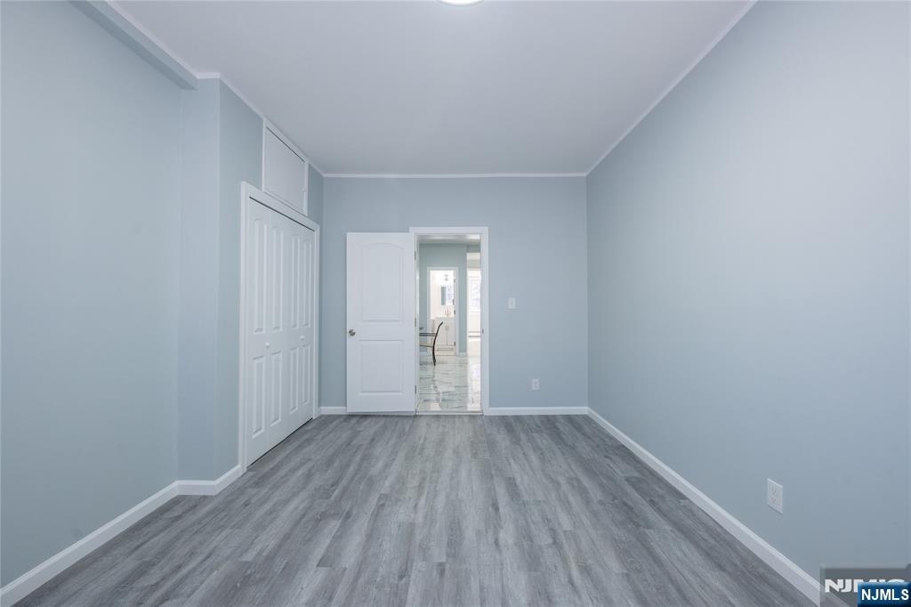 723 East 26th Street Paterson, NJ 07504 - Photo 4 of 41 a view of wooden floor in an empty room