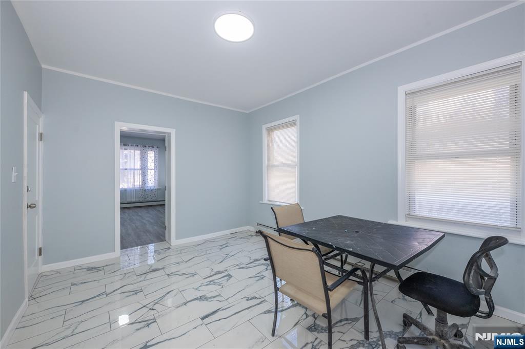 723 East 26th Street Paterson, NJ 07504 - Photo 6 of 41 a workspace room with furniture and window