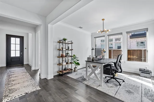 a view of a workspace with furniture and lounge chair