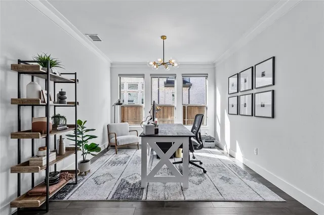 a work room with furniture and a chandelier