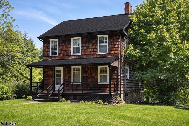 19 East Mill Road, Unit 1 Long Valley, NJ 07853 - Photo 1 of 1 front view of a house with a yard