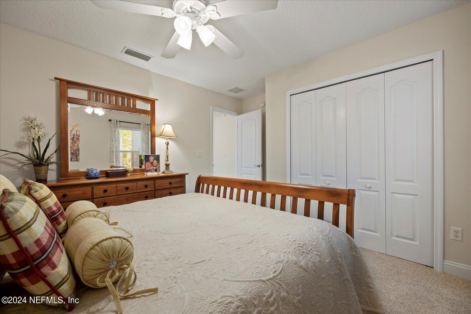 1283 Paradise Pond Road St. Augustine, FL 32092 - Photo 26 of 47 a bedroom with a bed and window