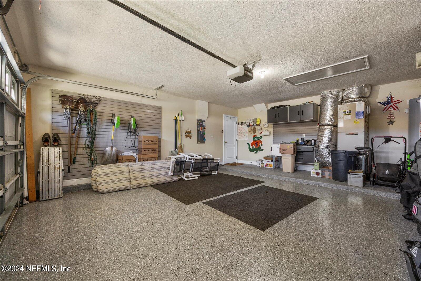 1283 Paradise Pond Road St. Augustine, FL 32092 - Photo 35 of 47 a living room with lots of furniture and gym equipment