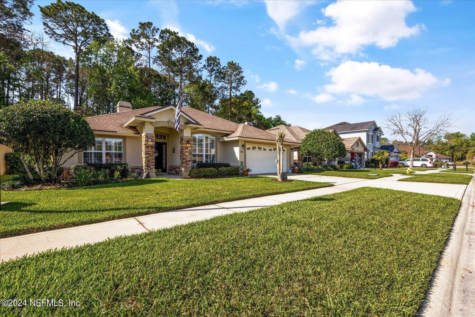1283 Paradise Pond Road St. Augustine, FL 32092 - Photo 40 of 47 a front view of a house with a yard