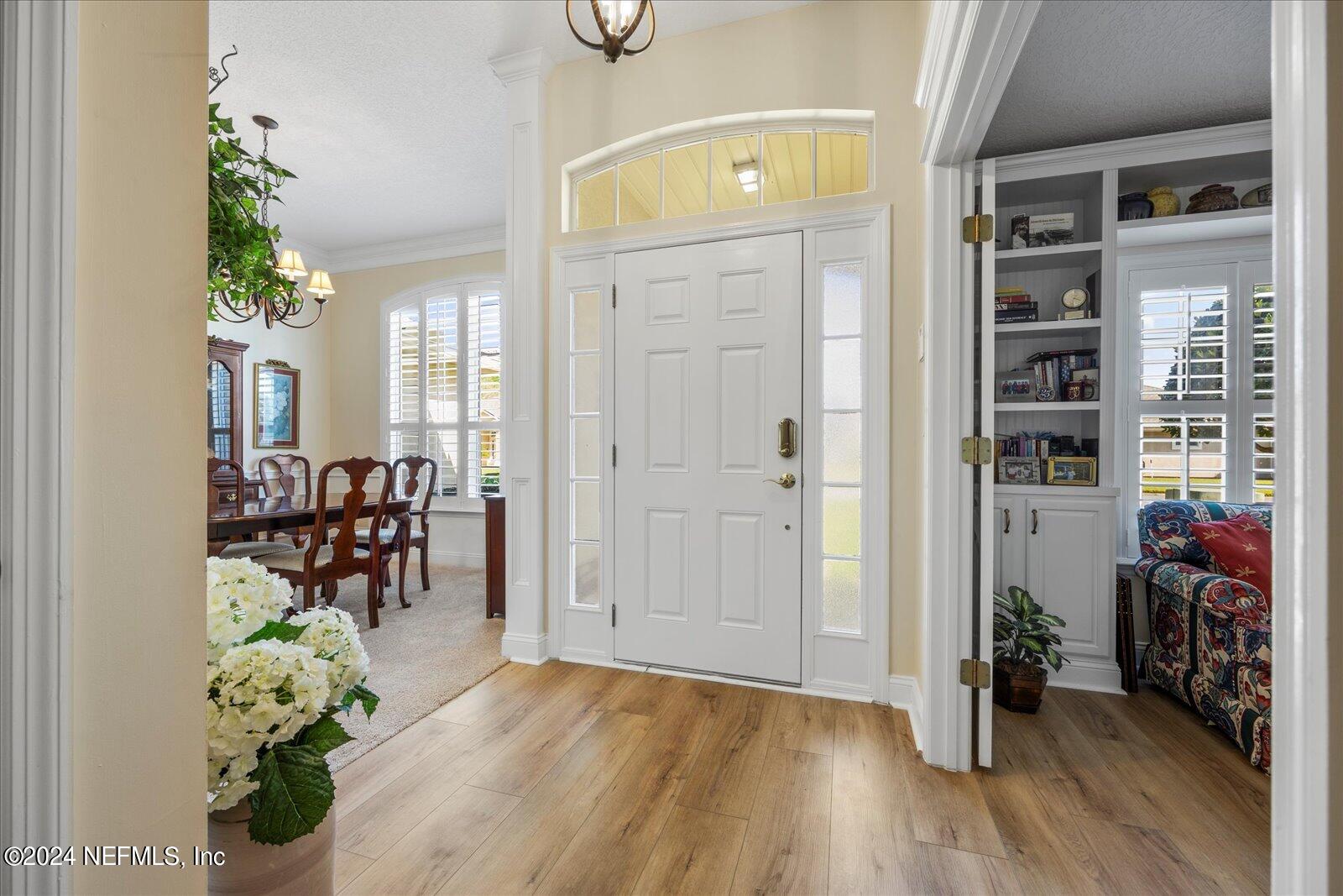 1283 Paradise Pond Road St. Augustine, FL 32092 - Photo 4 of 47 an entryway with dining room and livingroom with furniture