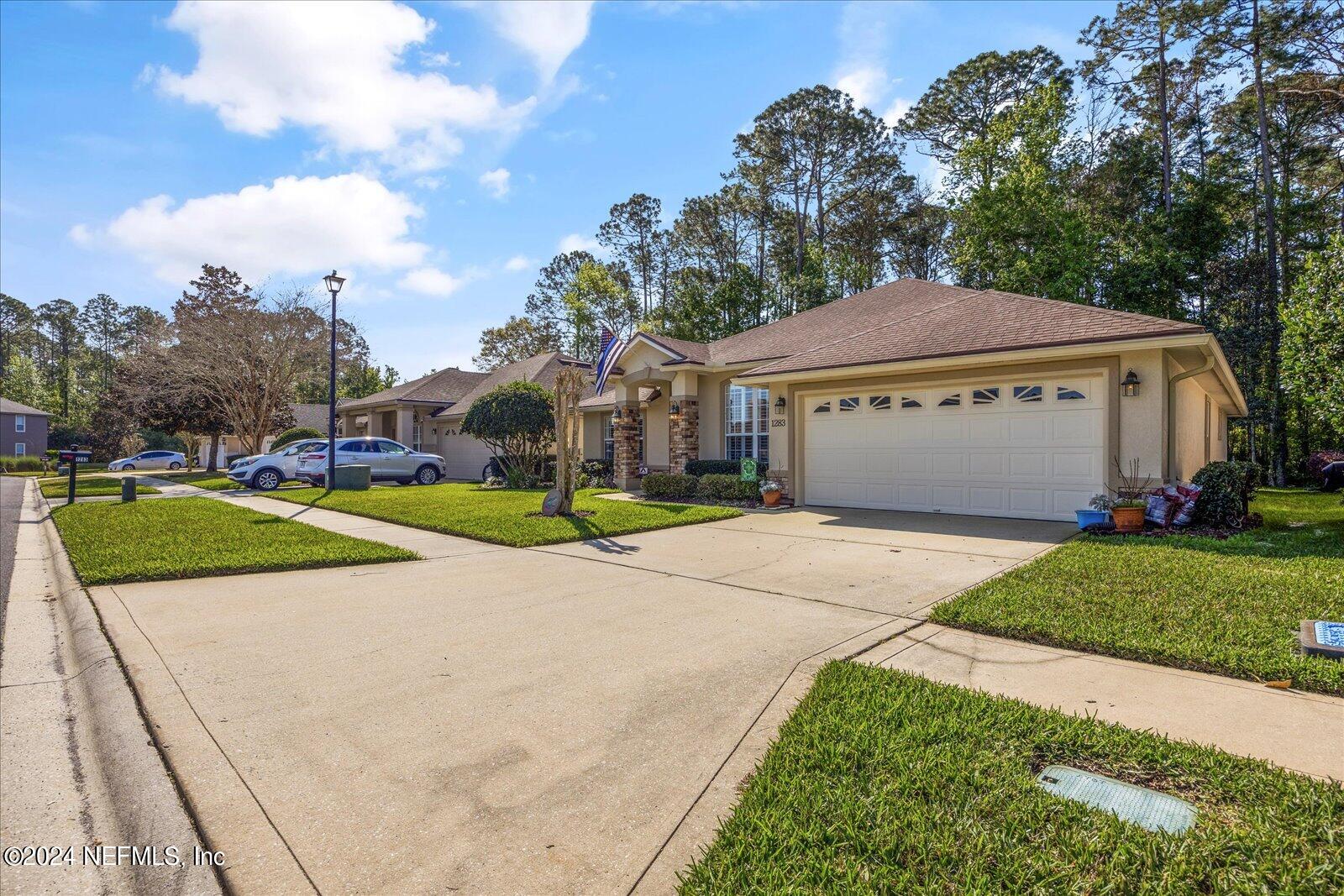1283 Paradise Pond Road St. Augustine, FL 32092 - Photo 41 of 47 a view of a house with a yard and large tree