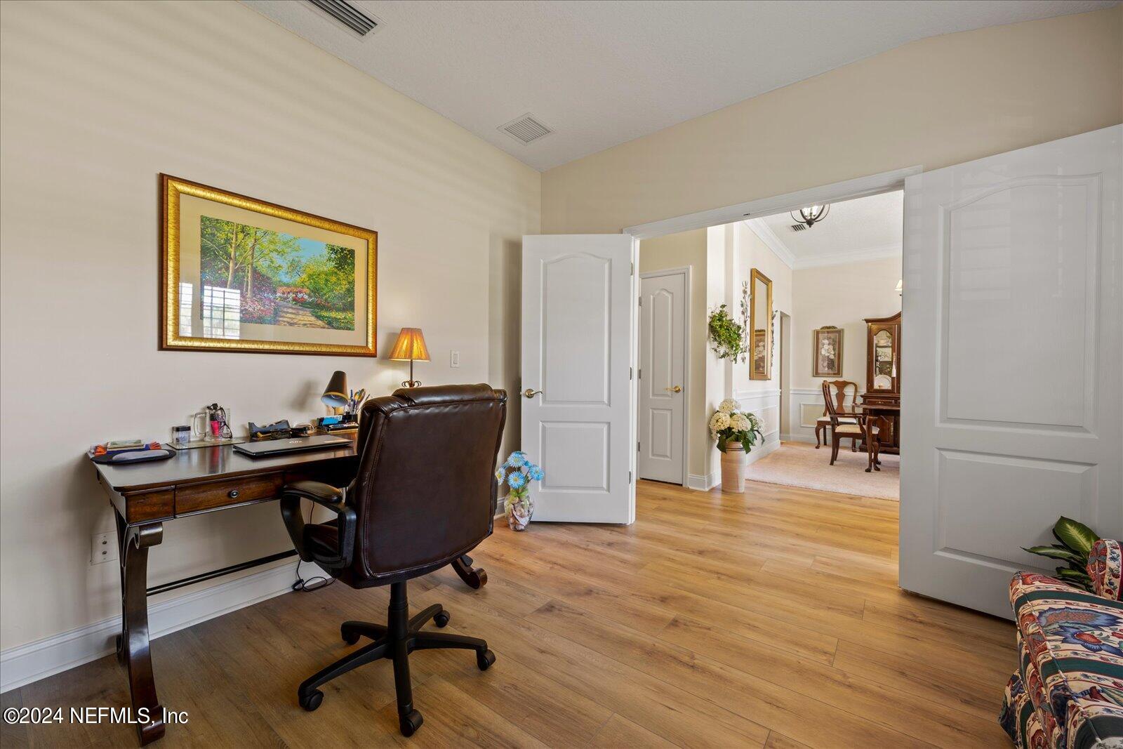 1283 Paradise Pond Road St. Augustine, FL 32092 - Photo 6 of 47 a view of a workspace with furniture and wooden floor