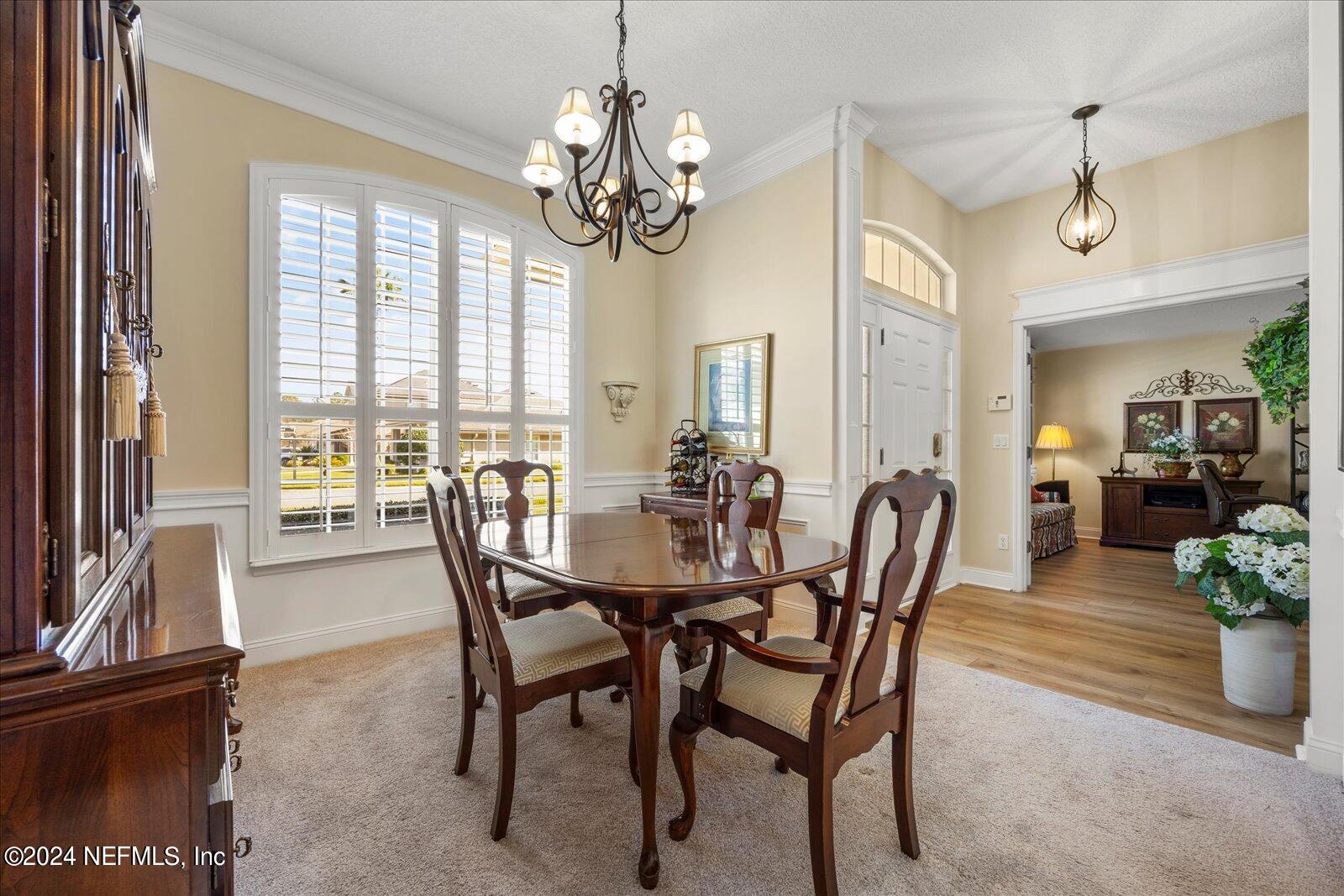 1283 Paradise Pond Road St. Augustine, FL 32092 - Photo 7 of 47 a view of a dining room with furniture window and outside view