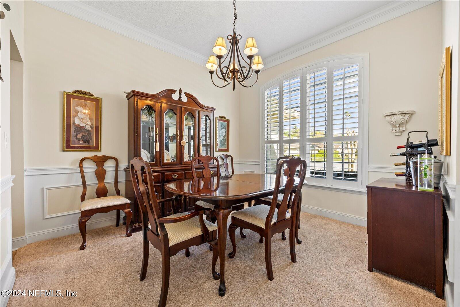 1283 Paradise Pond Road St. Augustine, FL 32092 - Photo 8 of 47 a view of a dining room with furniture window and outside view