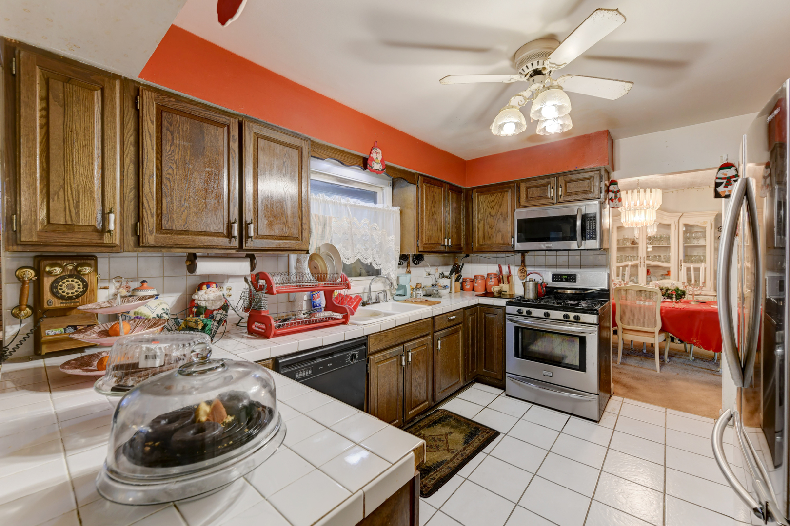 126 Denell Drive Crete, IL 60417 - Photo 20 of 30 a kitchen with a sink a stove and chairs