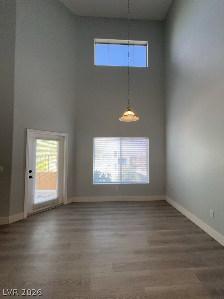 4915 East Russell Road, Unit 133 Las Vegas, NV 89120 - Photo 2 of 10 High ceilings elevate this flexible space, bathed in natural light from the broad windows.