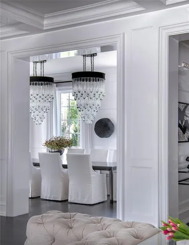 a view of a living room with a baby crib and a window