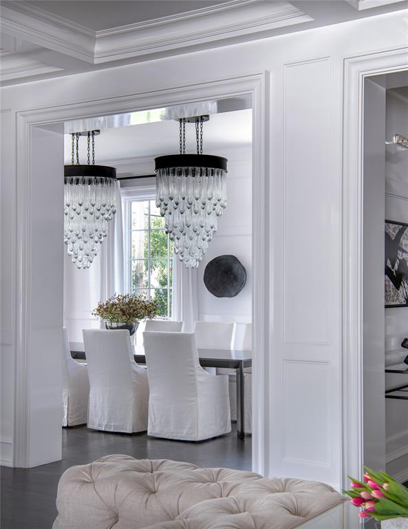 5947 Lupton Drive Dallas, TX 75225 - Photo 4 of 39 Dining area with a chandelier, crown molding, and wood finished floors