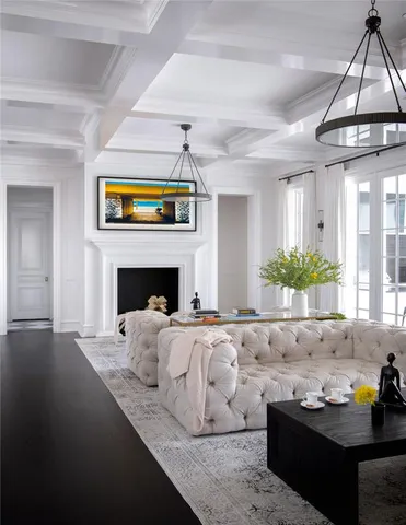 a living room with furniture fireplace and flat screen tv