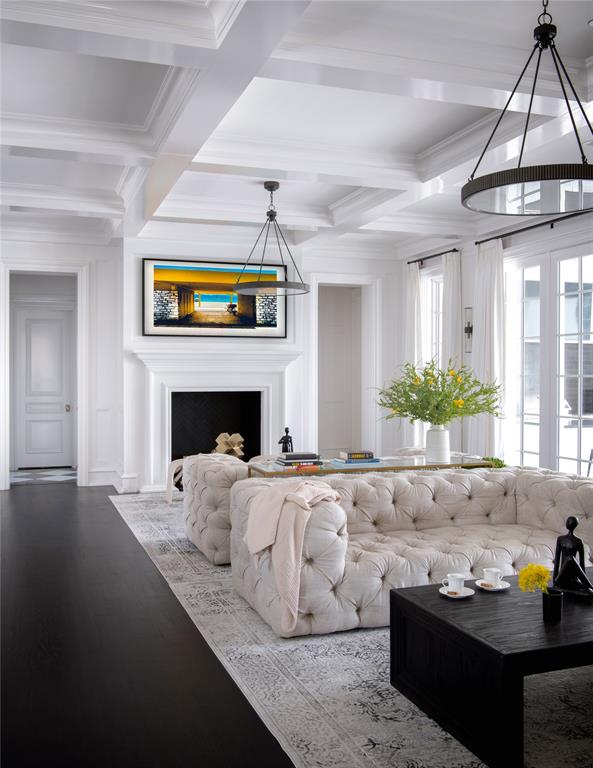 5947 Lupton Drive Dallas, TX 75225 - Photo 6 of 39 Living room featuring beamed ceiling, wood finished floors, crown molding, coffered ceiling, and a fireplace with flush hearth