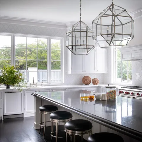 a kitchen with a sink and a stove