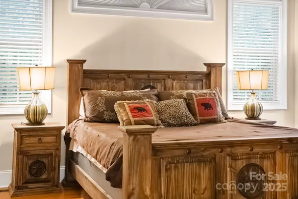 a bedroom with a bed and dresser