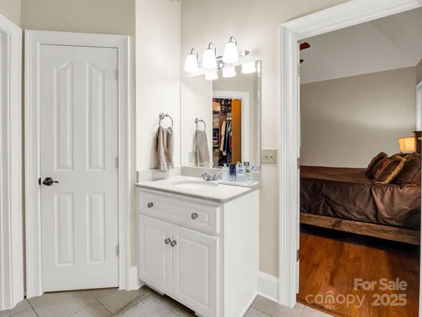 a bathroom with a sink vanity and a mirror