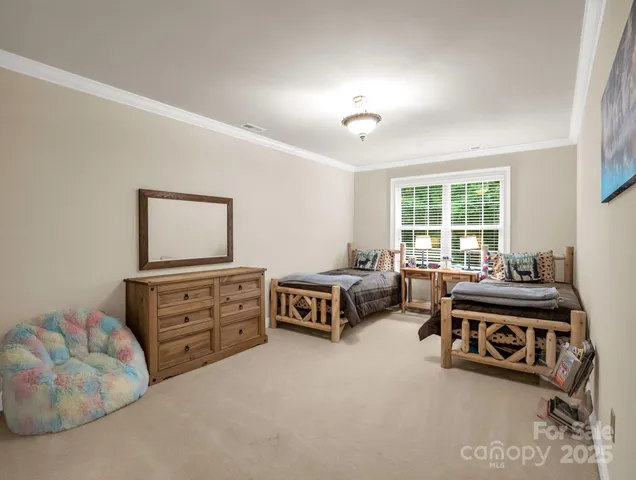 a bedroom with furniture and a dresser