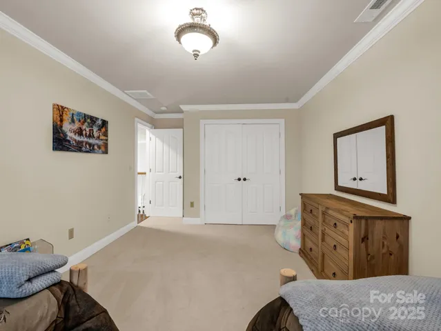 a bedroom with a bed and cabinets