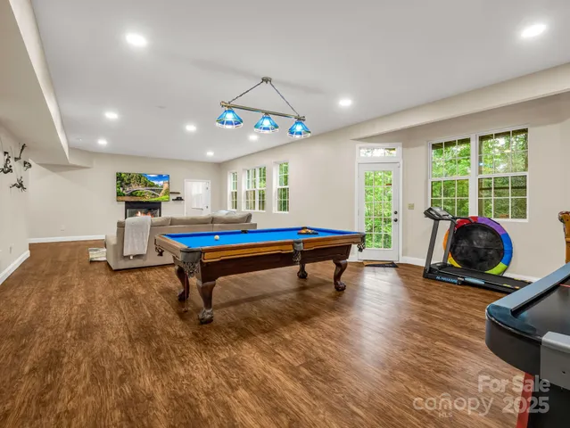 a room with furniture and pool table