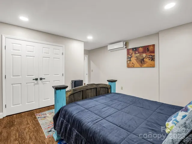 a bedroom with a bed and cabinets