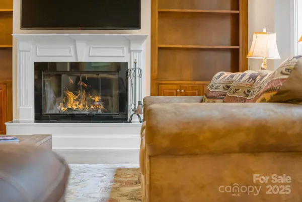 a bedroom with a bed and a fireplace