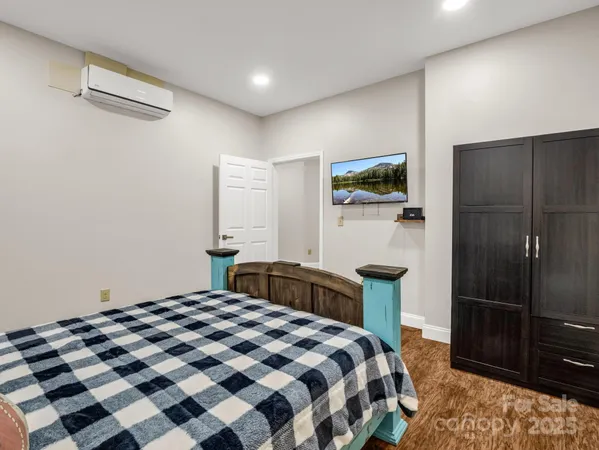 a bedroom with a bed and a walk in closet