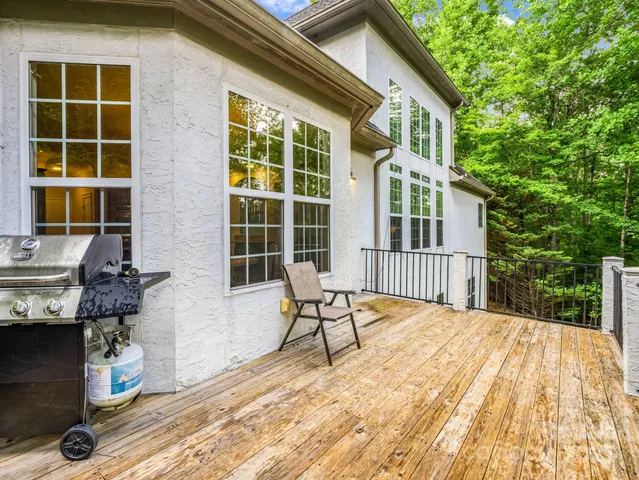 a balcony with table and chairs