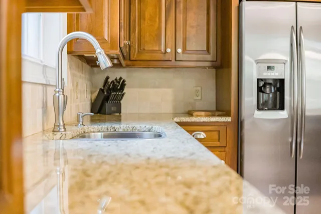 a bathroom with a granite countertop sink
