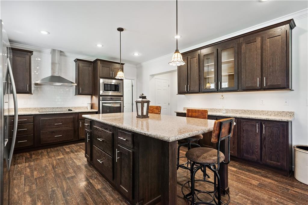 210 Shoaf Road Smithfield, PA 15478 - Photo 11 of 25 a kitchen with a table chairs refrigerator and microwave