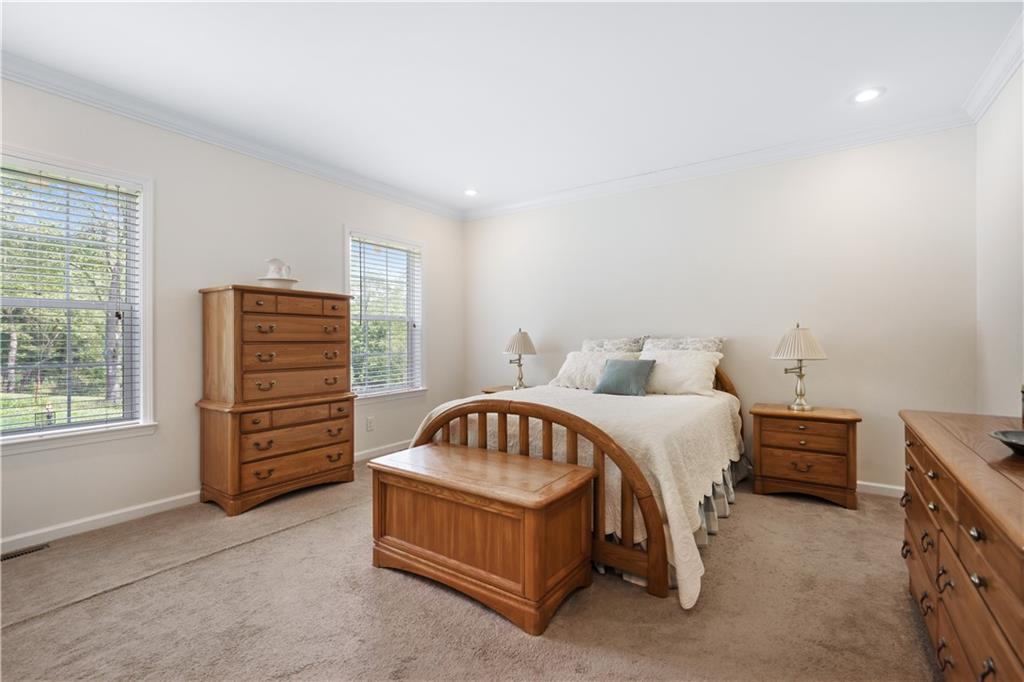 210 Shoaf Road Smithfield, PA 15478 - Photo 19 of 25 a spacious bedroom with a bed and a window