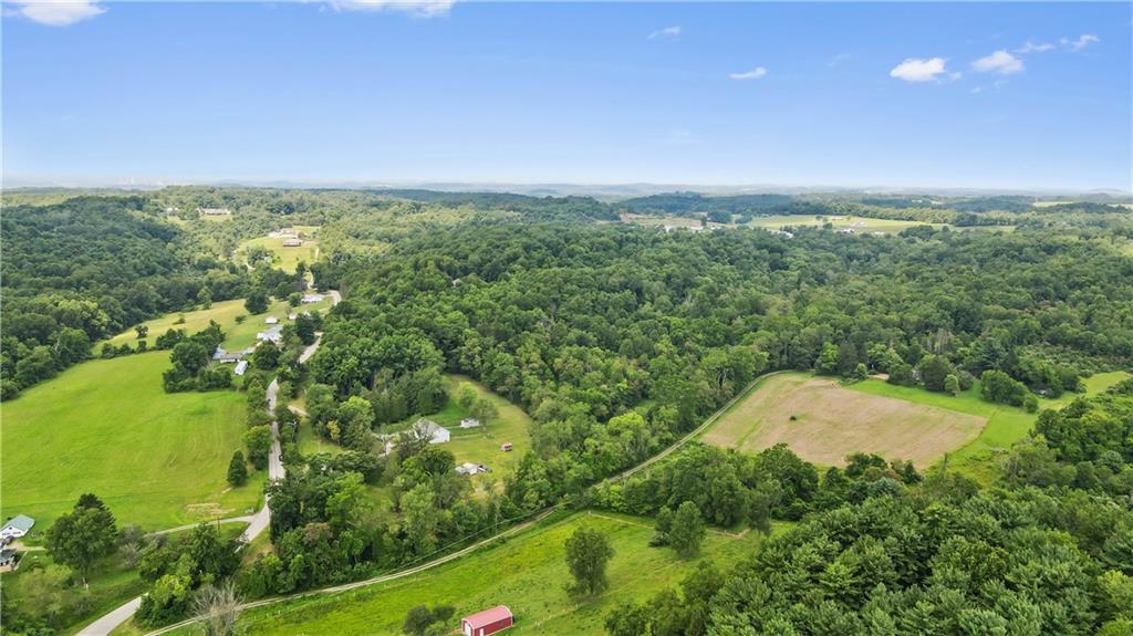 210 Shoaf Road Smithfield, PA 15478 - Photo 3 of 25 an aerial view of a residential houses with outdoor space and trees all around
