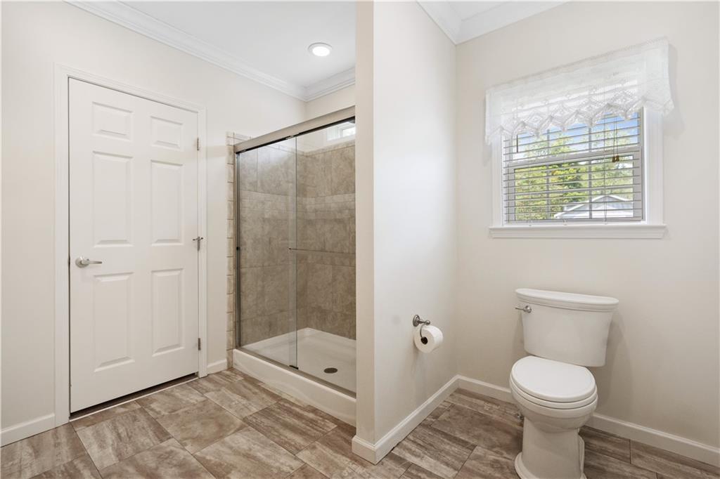 210 Shoaf Road Smithfield, PA 15478 - Photo 22 of 25 a bathroom with a toilet and a shower