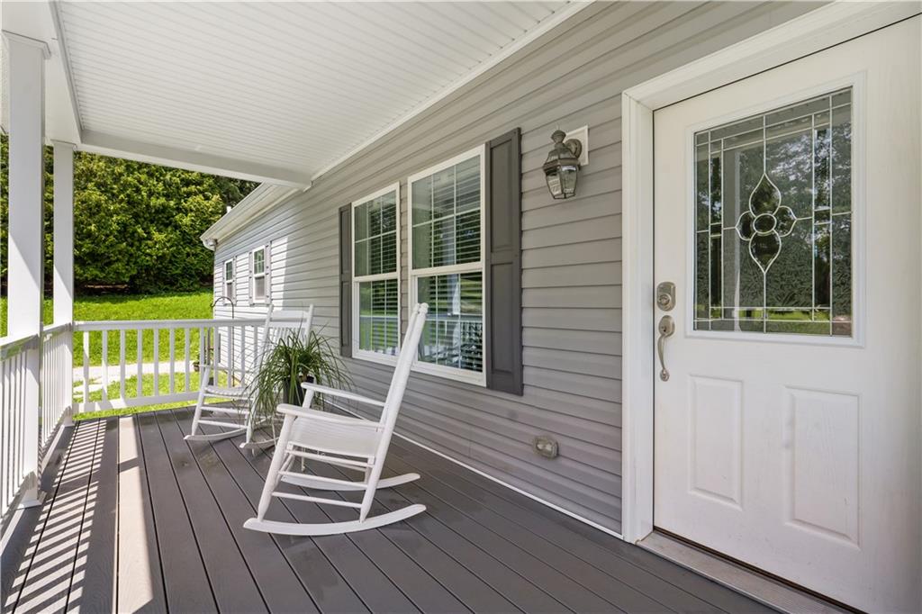 210 Shoaf Road Smithfield, PA 15478 - Photo 6 of 25 a view of a two chairs in the deck