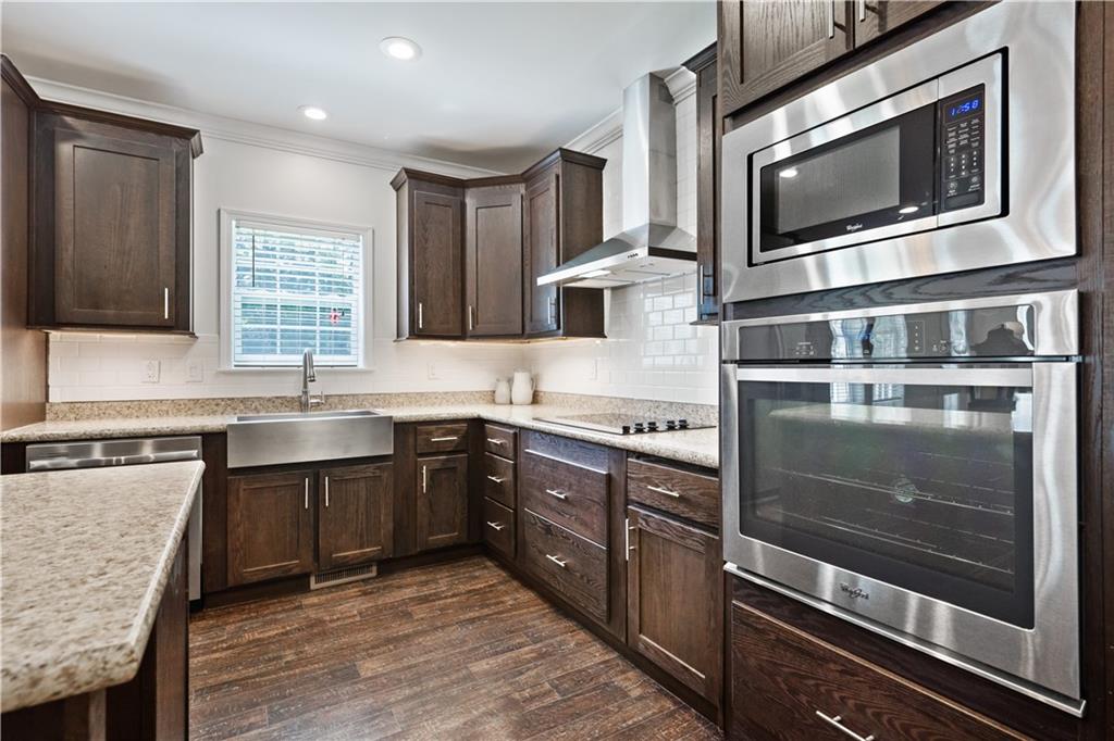 210 Shoaf Road Smithfield, PA 15478 - Photo 8 of 25 a kitchen with stainless steel appliances granite countertop a stove microwave and sink