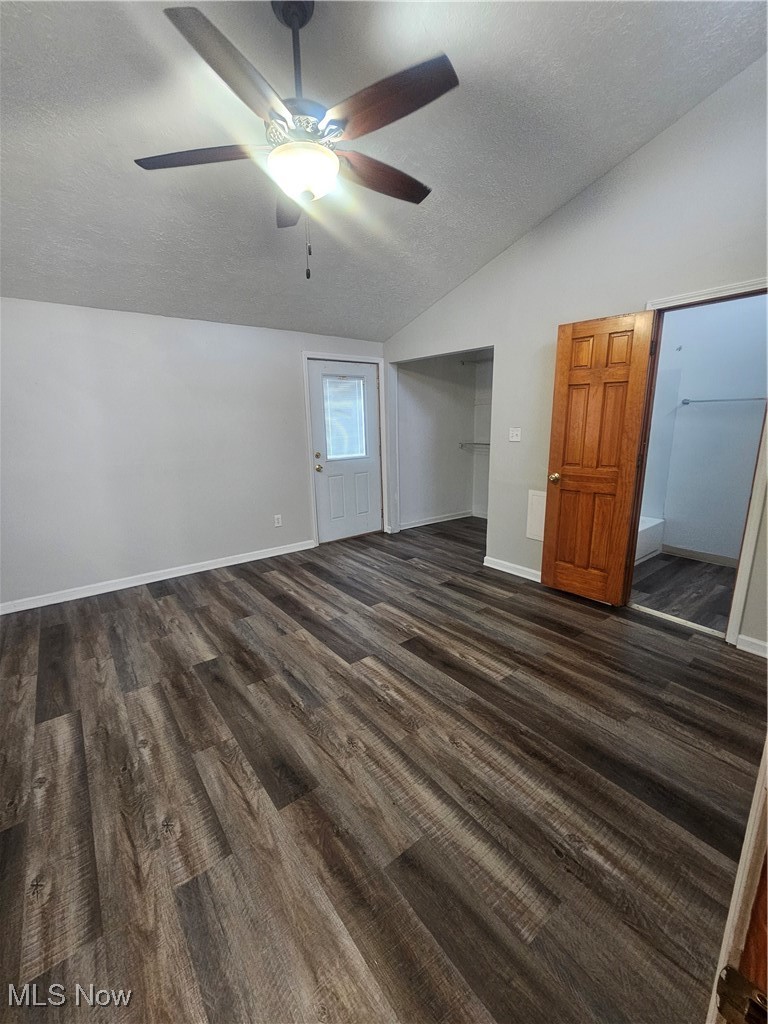 4495 Ammon Road Cleveland, OH 44143 - Photo 13 of 26 Unfurnished bedroom featuring lofted ceiling, a textured ceiling, a ceiling fan, and dark wood-style flooring