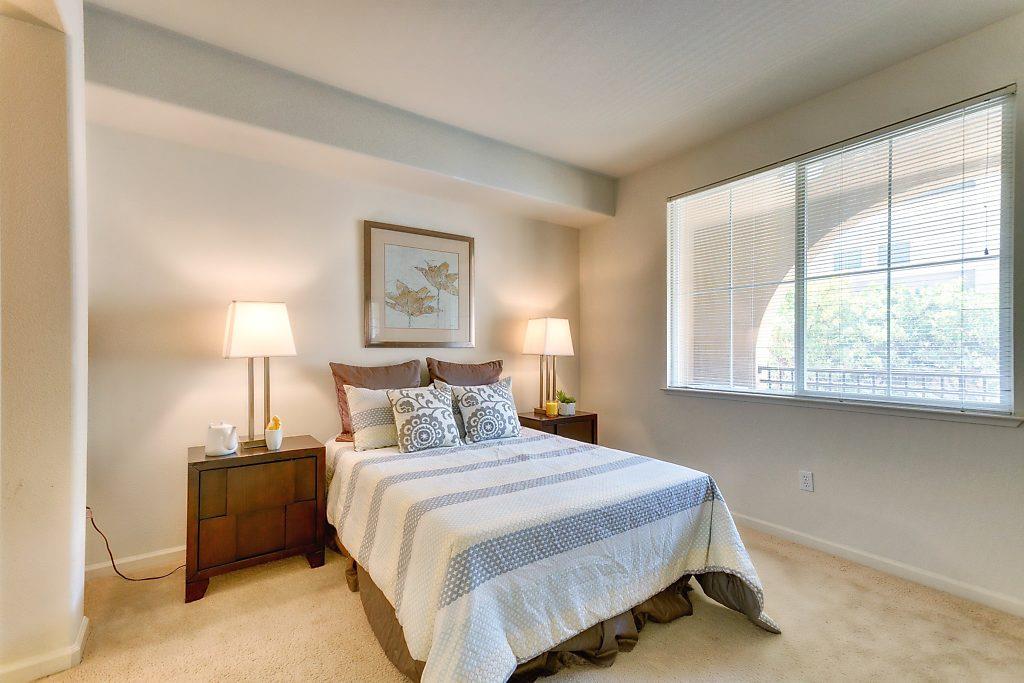 1883 Agnew Road, Unit 329 Santa Clara, CA 95054 - Photo 15 of 46 a bedroom with a bed and a lamp next to a window