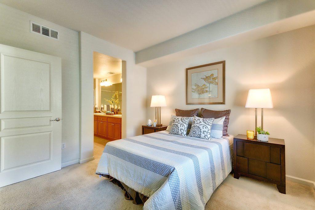 1883 Agnew Road, Unit 329 Santa Clara, CA 95054 - Photo 16 of 46 a bedroom with a bed and a lamp on table