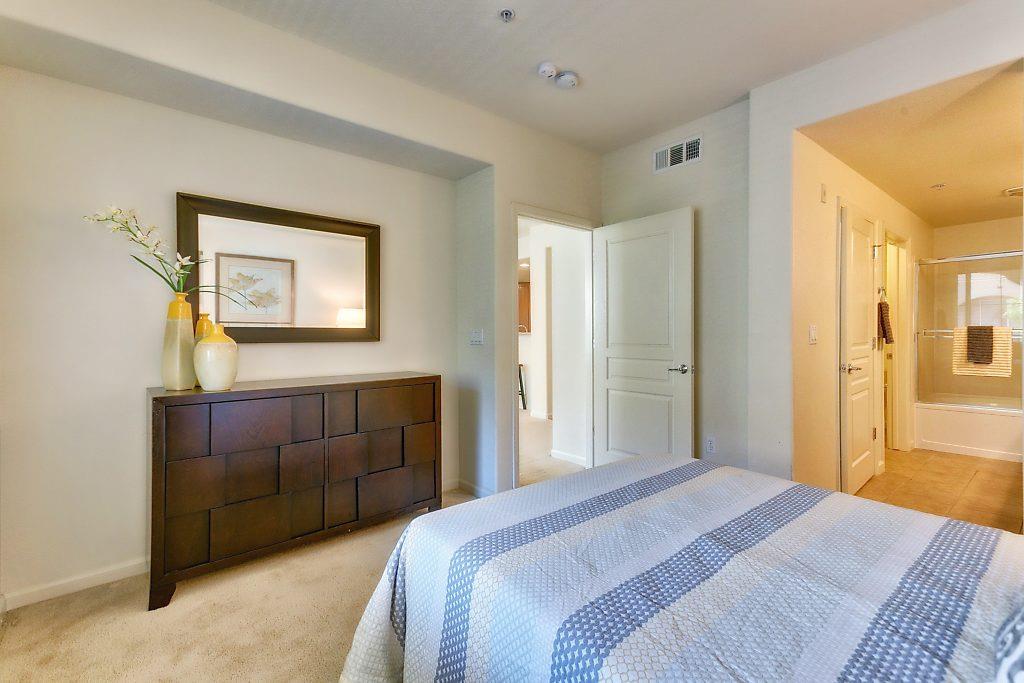 1883 Agnew Road, Unit 329 Santa Clara, CA 95054 - Photo 17 of 46 a bedroom with a bed and a mirror
