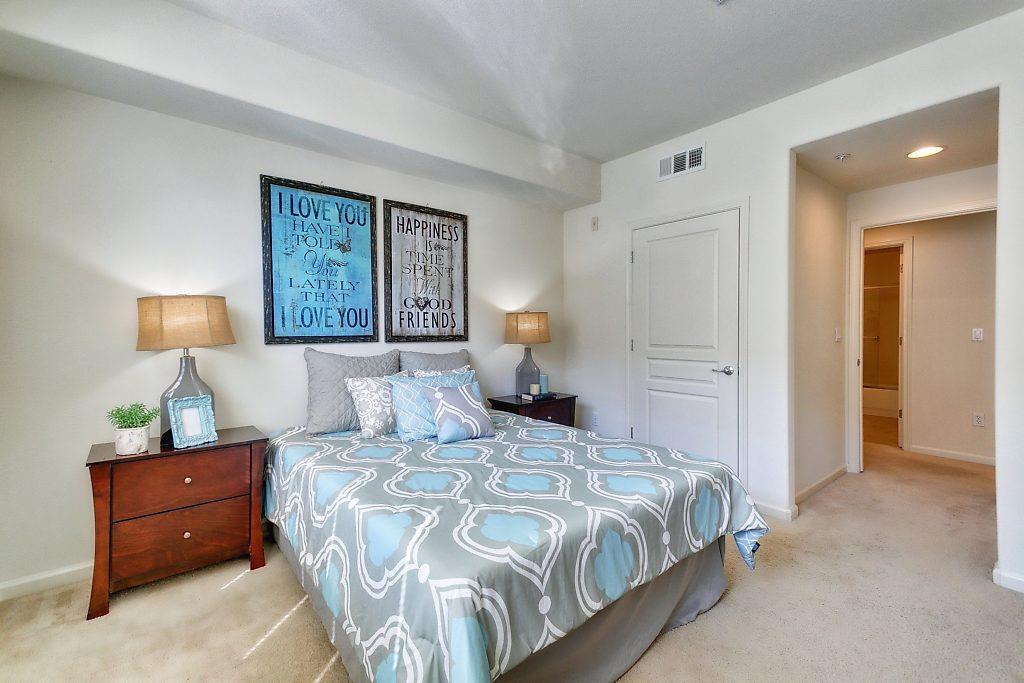 1883 Agnew Road, Unit 329 Santa Clara, CA 95054 - Photo 21 of 46 a bedroom with a bed and a night stand