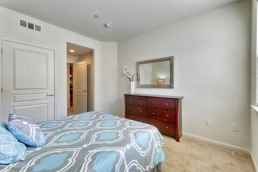 1883 Agnew Road, Unit 329 Santa Clara, CA 95054 - Photo 22 of 46 a bedroom with a bed and a dresser