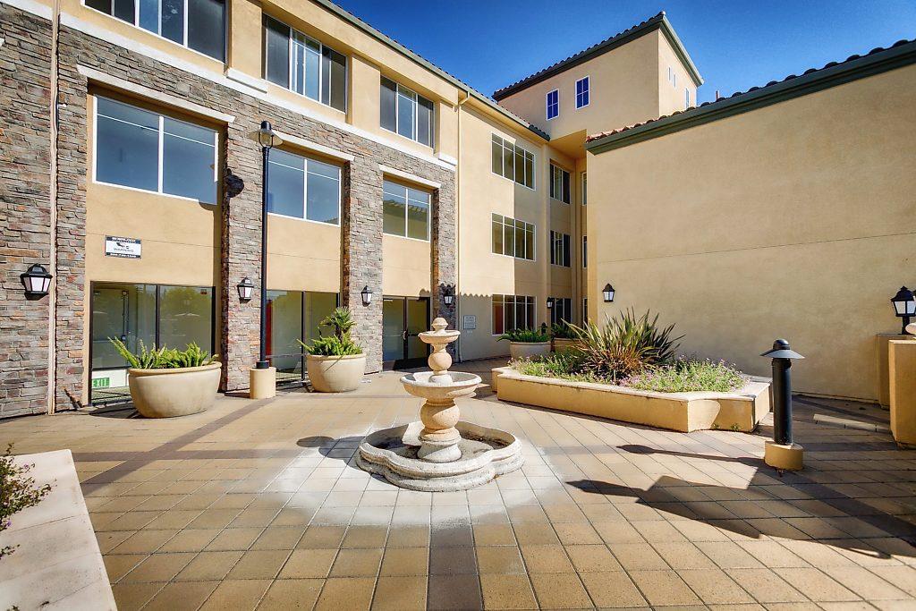 1883 Agnew Road, Unit 329 Santa Clara, CA 95054 - Photo 31 of 46 a view of a patio with couches table and chairs and potted plants