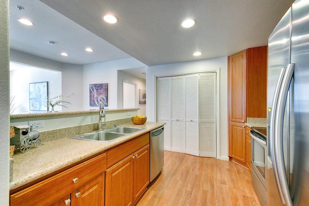 1883 Agnew Road, Unit 329 Santa Clara, CA 95054 - Photo 5 of 46 a view of a kitchen with a sink and refrigerator