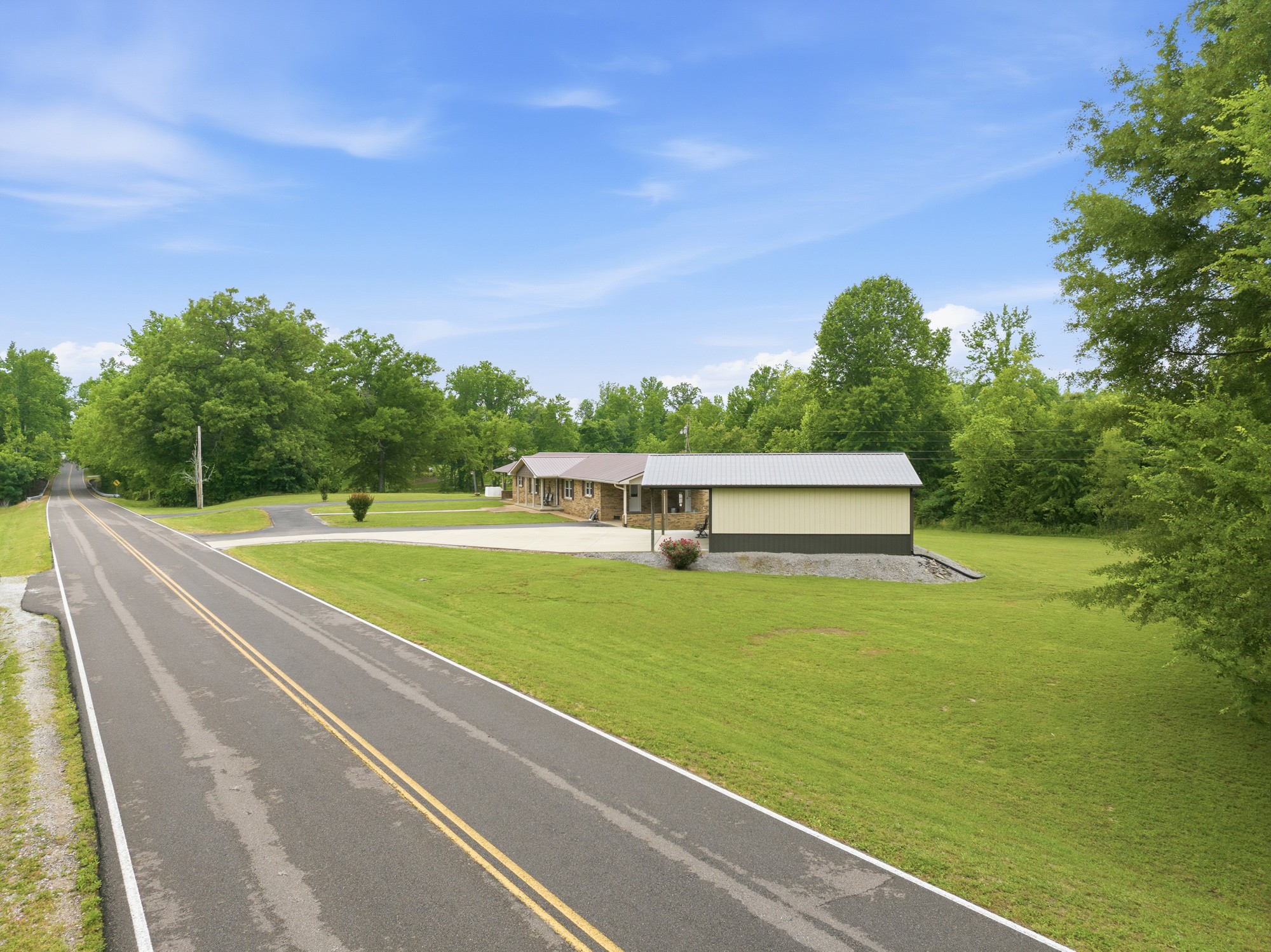 944 Brooksie Thompson Road Decaturville, TN 38329 - Photo 44 of 47 a view of a big yard with large trees