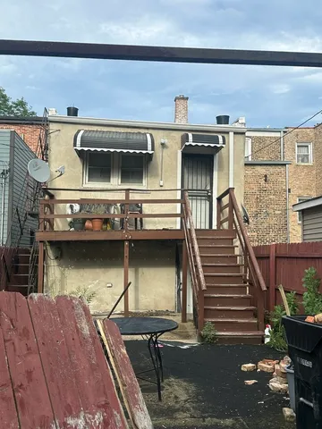 a dining room with furniture and a flat screen tv