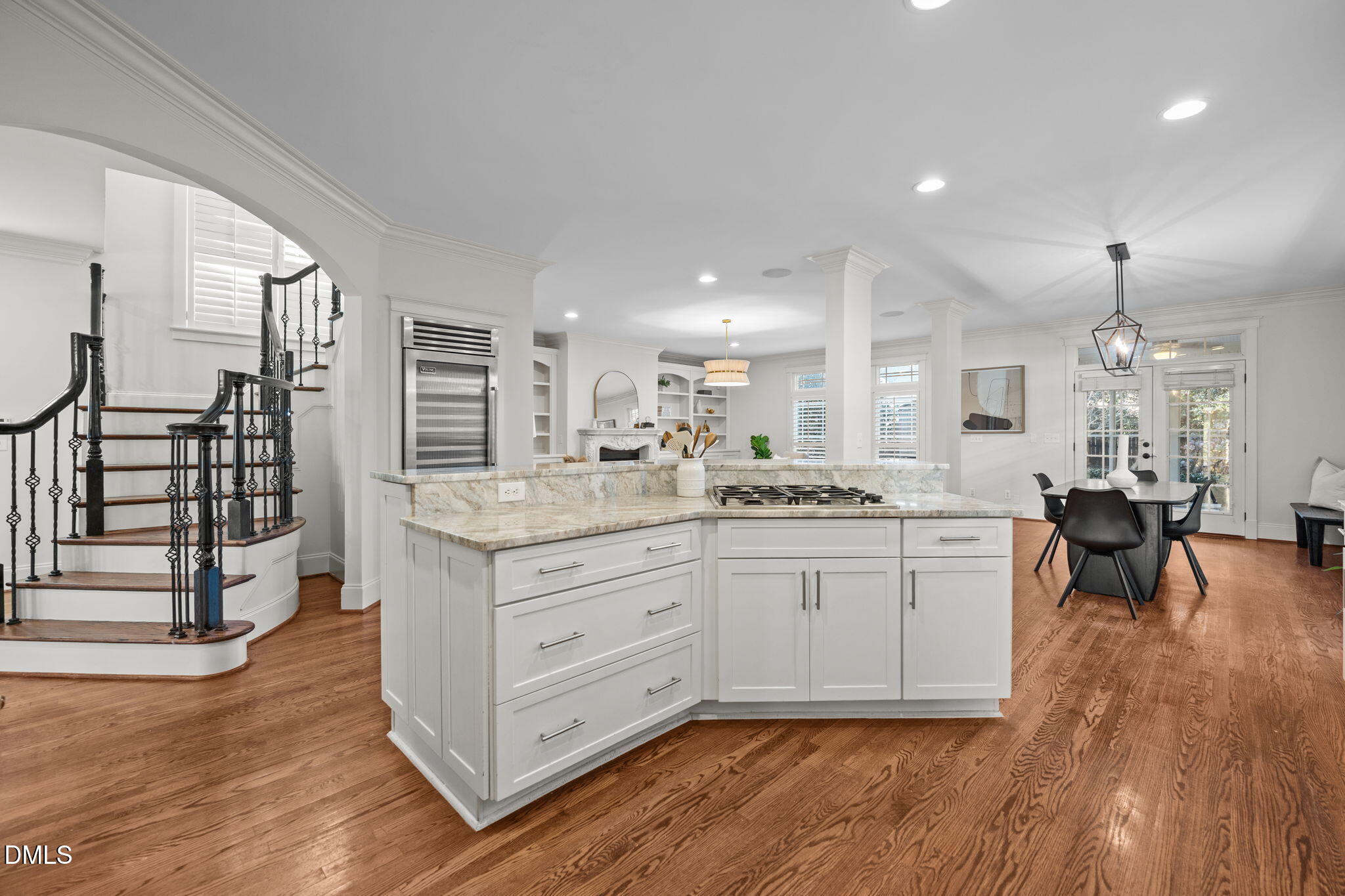 1705 Carson Street Raleigh, NC 27608 - Photo 11 of 47 a kitchen with granite countertop a stove a sink a dining table and chairs with wooden floor