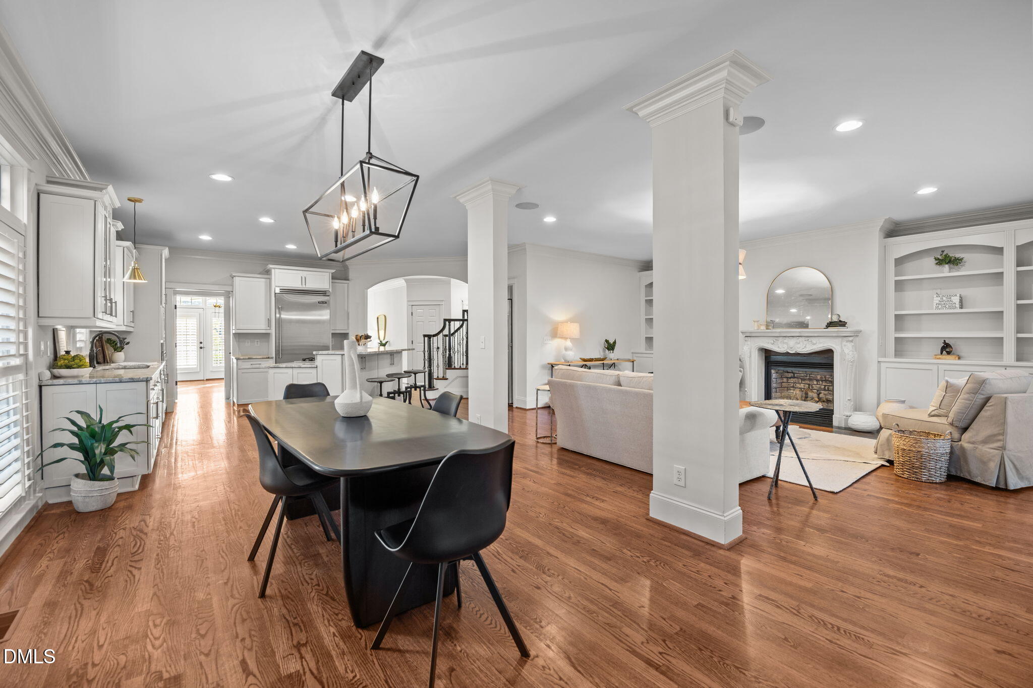 1705 Carson Street Raleigh, NC 27608 - Photo 13 of 47 a view of a dining room with furniture wooden floor and a chandelier