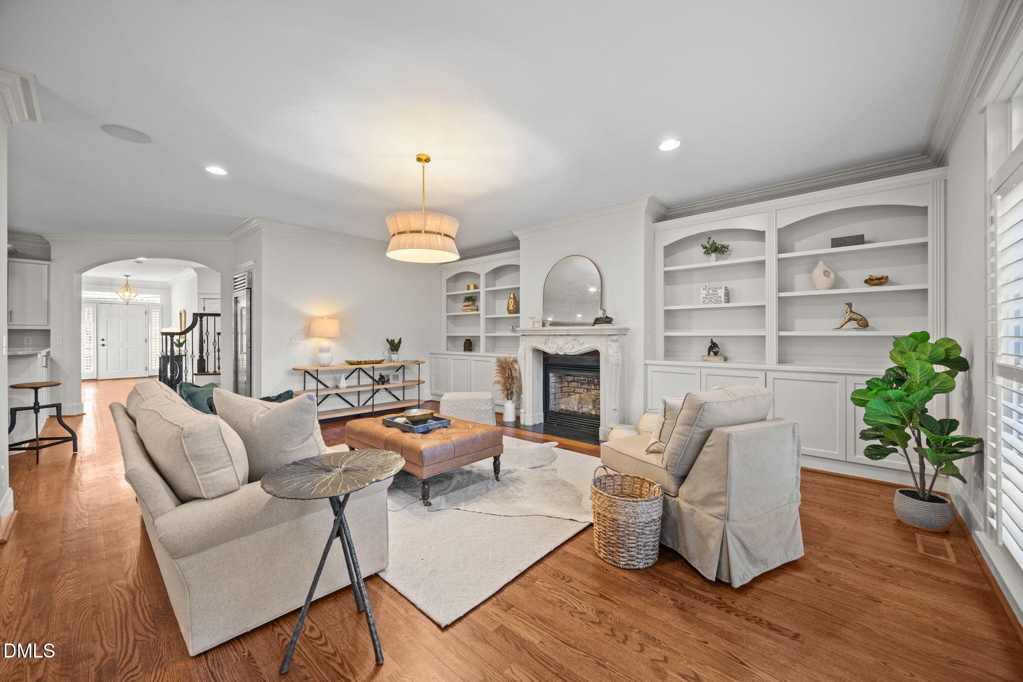 1705 Carson Street Raleigh, NC 27608 - Photo 14 of 47 a living room with furniture a fireplace and a potted plant