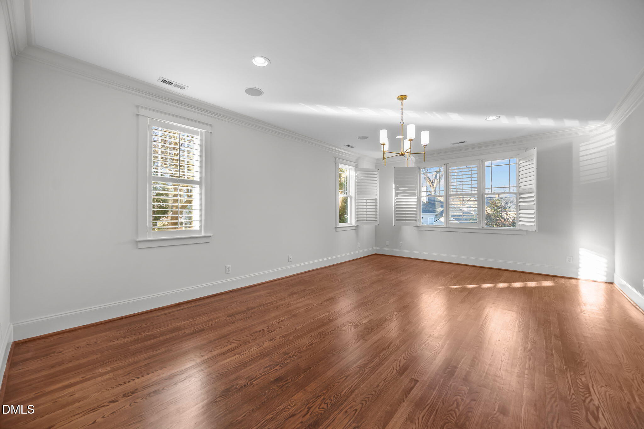 1705 Carson Street Raleigh, NC 27608 - Photo 21 of 47 a view of an empty room with wooden floor and a window